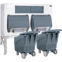 Follett ice management shuttle system with double doors and carts for efficient ice handling.